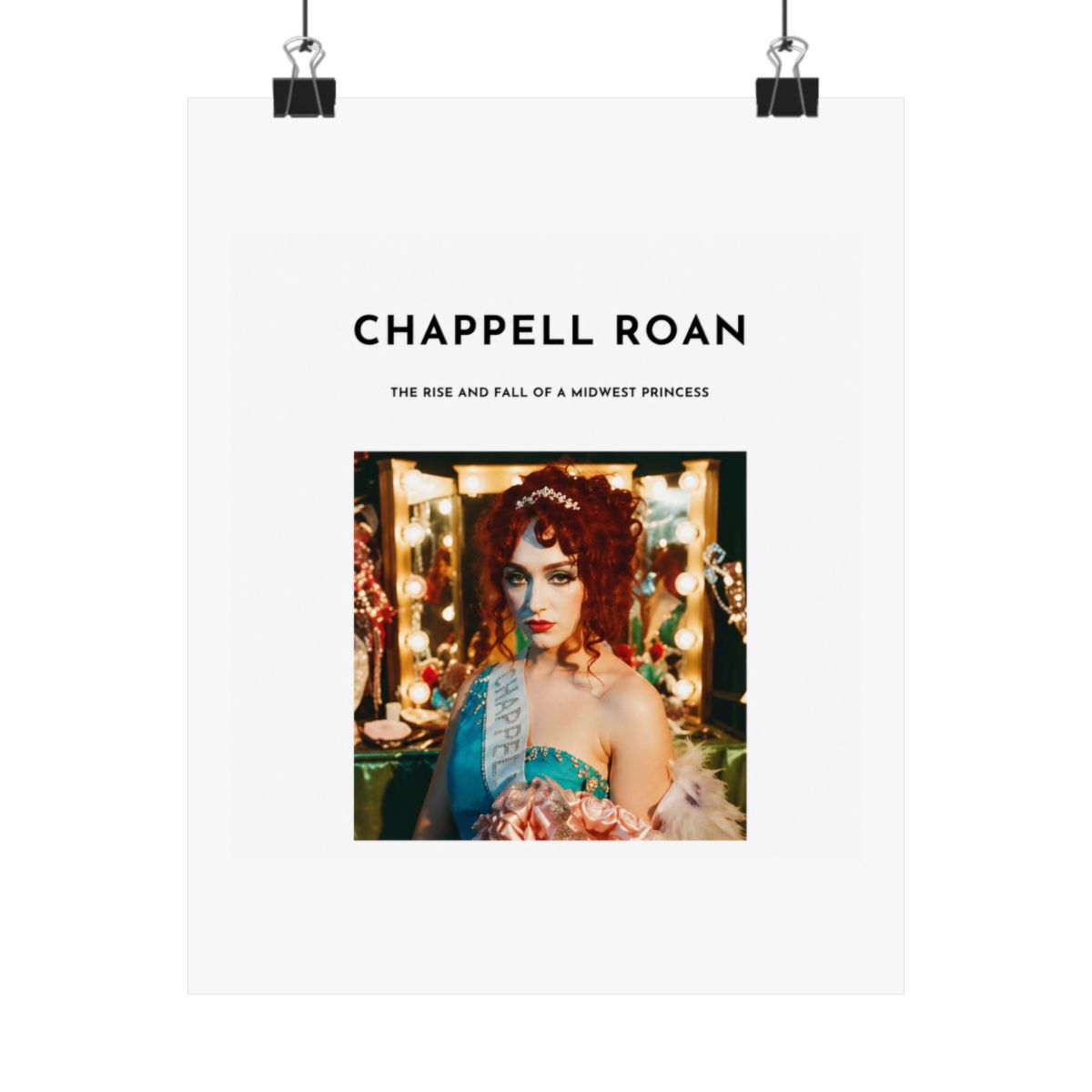 A Dresses with a white background and black text that reads "Chappell Roan, The Rise and Fall of a Midwest Princess". The Dresses features a photo of a woman with red hair wearing a blue and white... - alternate angle 4, merchandise
