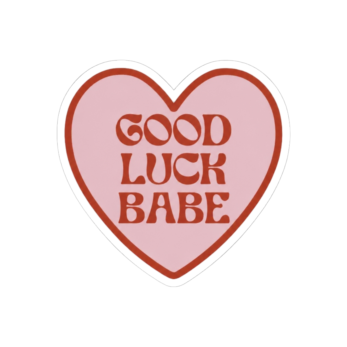 A heart-shaped sticker with a pink interior and a dark red border. The sticker features the words "GOOD LUCK BABE" in dark red, retro-style lettering. The sticker is held between two fingers against a... - Official Stickers merchandise